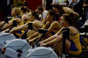 Image of six rowers competing on rowing machines.