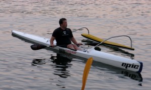 Kevin paddling a surfski.